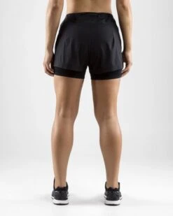 Craft Essential 2-in-1 Hardloop Short Zwart Dames -Craft 1906029 999000 essential 2 in 1 shorts c3